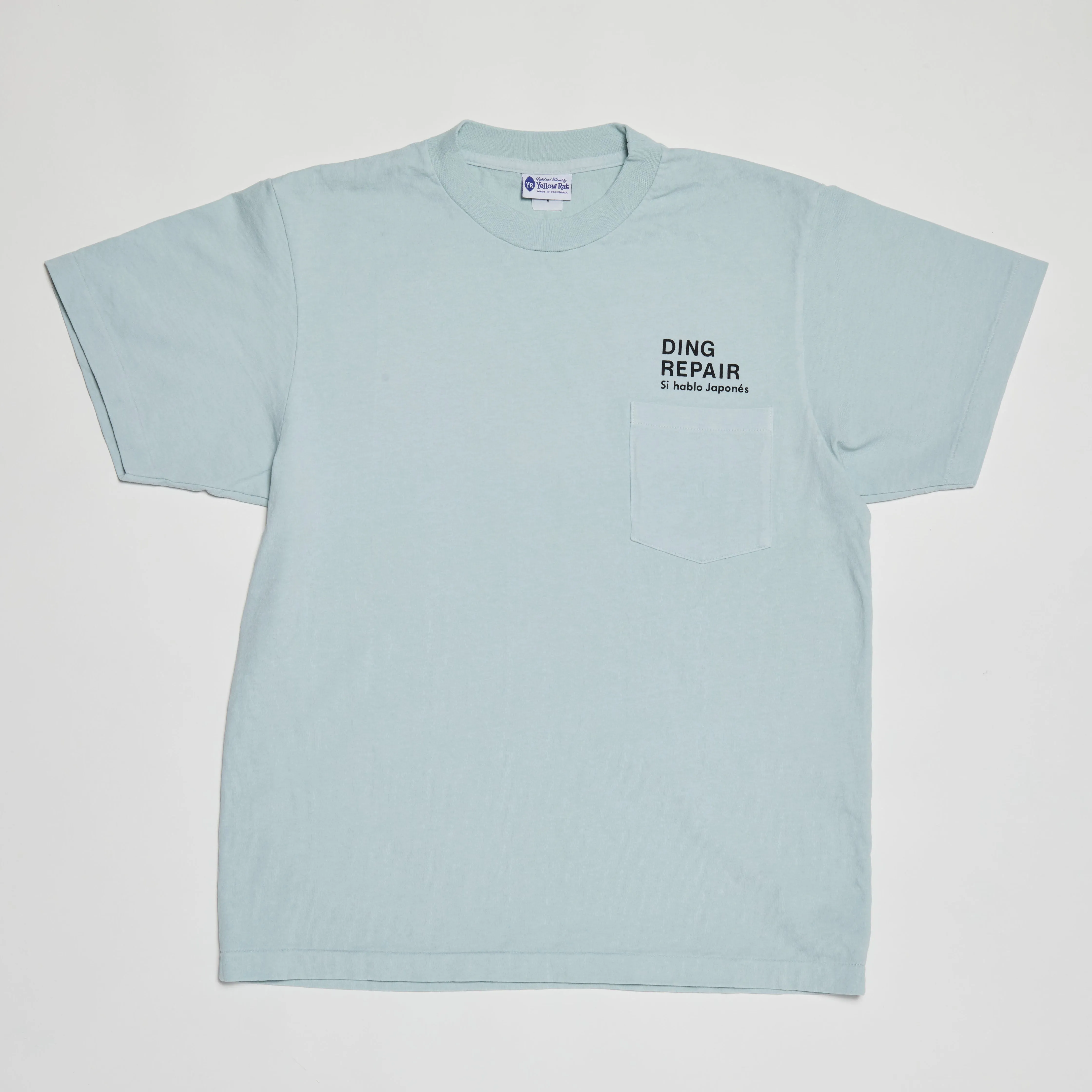 Kio’s Ding Repair 5th Generation T-Shirt (Dusty Blue)