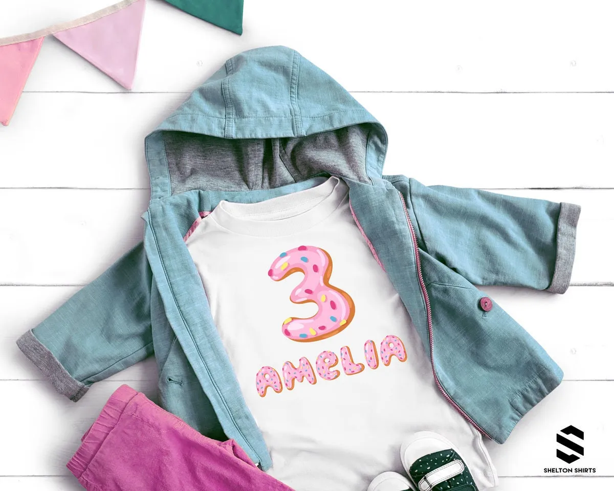 Pink Donut Birthday Shirt with Printed Frosted Number and Sprinkle Name