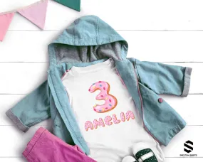 Pink Donut Birthday Shirt with Printed Frosted Number and Sprinkle Name